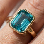 Load image into Gallery viewer, Tear Blue Topaz Ring Gold | Emerald Cut Bezel Solitaire | 18k Gold plated 925 Silver | Statement Ring | Birthday gift for her