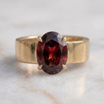Load image into Gallery viewer, Men's Oval Garnet Solitaire Ring | Wide Cigar Band Ring for Men | 18K Gold Plated 925 Silver | Red Gemstone Ring | Unisex Statement Ring