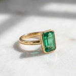 Load image into Gallery viewer, Emerald Solitaire Ring | 18K Gold Bezel Ring | Emerald Cut Engagement Ring | Minimalist Statement Ring | May Birthstone Ring