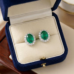 Load image into Gallery viewer, Oval Emerald Halo Stud Earrings 925 Silver | May Birthstone Pave Studs | Lab Emerald Bridal Jewelry | Anniversary Gift For Her | Green