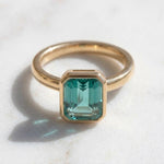 Load image into Gallery viewer, Tear Blue Topaz Ring Gold | Emerald Cut Bezel Solitaire | 18k Gold plated 925 Silver | Statement Ring | Birthday gift for her