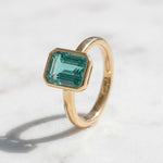 Load image into Gallery viewer, Tear Blue Topaz Ring Gold | Emerald Cut Bezel Solitaire | 18k Gold plated 925 Silver | Statement Ring | Birthday gift for her